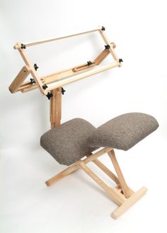 a chair that is made out of wood and fabric