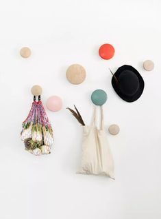 an assortment of objects are displayed on a white surface with circles and balls in the background