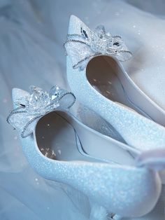 Bridal bow heels are a type of shoe that is specifically designed for a bride to wear on her wedding day. The bow is often made of the same material as the shoe and can be adorned with sparkling crystals or other embellishments to add a touch of glamour and femininity to the bridal ensemble. These shoes are a romantic and playful option for a bride who wants to add a touch of whimsy to her wedding day look. Crystal chain embellishment lampskin Pointed toe Stiletto heel Heel height measures: 60mm Wedding Shoes With Bow, Bridal Bow, Handmade Jewlery, Crystal Heels, Winter Wonderland Wedding, Bridal Heels, Bow Heels, Crystal Chain, Romantic Style