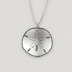 This sterling silver sand dollar necklace is a beautiful reminder of the ocean waves and summer days at the beach all year long.  It has an incredible shine that you will love every time that you look at it. Charm comes in four sizes: - 3/4in (20mm) - 1in (24mm) - 1.18in (30mm - 1.5in (38mm) Chains come in two lengths: - 18in (45cm) - 20in (50cm) Charms are a sturdy and solid .032in (0.8mm), 20 gauge sterling silver. Chains are a .047in (1.2mm) thickness Italian sterling silver curb chain. All j Ocean-inspired Round Jewelry With Starfish Charm, Ocean-inspired Strand Charm Necklaces As Gift, Adjustable Pendant Charm Necklaces For Beach, Ocean-inspired Starfish Necklace For Beach, Ocean-inspired Beach Jewelry, Beachy Starfish Charm Jewelry For Gifts, Sterling Silver Pendant Jewelry For Beach, Ocean Color Pendant Jewelry For Beach, Ocean-inspired Sterling Silver Beach Jewelry