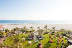 an aerial view of the beach and lawn area