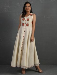 A double-layered umbrella cut front open Chanderi kurta with all-over floral buttis in yoke made using beads, sequins and silk French knots. Beadwork runs along the neckline and armhole. Contrast buttons and scalloped edges embroidered double layered flared hemline. The kurta comes with a delicate chanderi dupatta with all over sequence work and a wide woven zari border at the hem. Kurta measurements (in Inches): Size S: Bust - 38", Waist - 35", Length: 52" Size M: Bust - 40", Waist - 37", Lengt Summer Anarkali Set With Floral Embroidery, Chanderi Sleeveless Dresses For Festivals, Traditional Sleeveless Embroidered Dress For Festive Occasions, Traditional Sleeveless Embroidered Festive Dress, Festival Sleeveless Chanderi Dresses, Sleeveless Chanderi Anarkali Dress, Sleeveless Anarkali Kurta For Summer, Summer Festive Anarkali Embroidered Dress, Designer Embellished Beige Dress