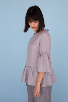 MsWrinkle’s clothing – from human to human.  100% handmade.*Description*- Linen blouse with ruffles and cute bow on the back;- High quality European linen;- Washed and softened (doesn't shrink anymore);- Medium weight linen (150 g/m2);- Our linen is OEKO-TEX certified that meets human ecological safety requirements;- Model is wearing size S in elephant grey (other sizes and colors please choose on the right);- Not transparent;- Not ironed and we suggest to use tumble dryer to keep soft and natur Spring Tops With Gathered Sleeves And Relaxed Fit, Spring Relaxed Fit Top With Gathered Sleeves, Relaxed Fit Blouse With Ruffle Sleeves And Details, Ruffle Sleeve Blouse With Relaxed Fit, Summer Tops With Gathered Flutter Sleeves, Fitted Linen Top For Casual Gatherings, Casual Blouse With Ruffle Gathered Sleeves, Blouse With Ruffle Sleeves And Relaxed Fit, Summer Flutter Sleeve Top With Gathered Sleeves