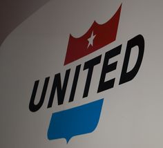 the united airlines logo is displayed on a wall