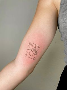 a woman's arm with a small tattoo on the left side of her arm