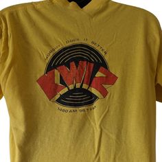 KWIZ 1480 AM 96.7 FM Vintage 70s Tshirt Nobody Does It Better Size L Tagged an XL but measures like a Large  Some marks/paint  A few small holes  Graphic is on back of shirt (front is blank)  Graphic has wear Measurements in photos Vintage Crew Neck Top With Logo Print, Retro Yellow Tops With Logo Print, Retro Yellow Shirt With Screen Print, Vintage Crew Neck Shirt With Logo Print, Vintage Yellow Crew Neck Shirt, Retro Yellow Crew Neck Shirt, Vintage Yellow Top With Screen Print, Vintage Yellow Tops With Screen Print, Yellow Vintage Crew Neck Top