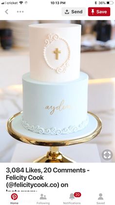 a white and gold wedding cake sitting on top of a table