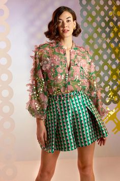 Green and pink sheer bomber jacket, hand embellished with floral appliques and geometric motifs. Comes with an inner. 
Component: 2
Pattern: Embellished
Type Of Work: Floral Appliques
Neckline: Band Collar
Sleeve Type: Puff Sleeves
Fabric: Organza
Color: Green, Pink
Other Details: 
Sheer jacket
Front zipper
Floral appliques
Note: The skirt and belt worn by the model is not for sale
Occasion: Party - Aza Fashions Pankaj And Nidhi, Sheer Jacket, Geometric Motifs, Jacket For Women, Skirts Online, Green And Pink, Green Satin, Green Skirt, Skorts