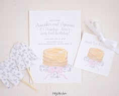 a card with some cake on it next to other items