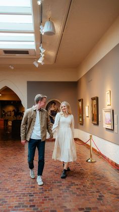 A couple poses for engagement photos in a local art museum Boston Engagement Photos, Museum Outfit