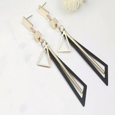 Nwt Long Geometric Triangle Earrings - Black Introducing Our Indulgent Nwt Long Geometric Triangle Earrings In A Chic And Timeless Blacka Manifestation Of Modern Luxury And Refined Sophistication. These Earrings, Brand New With Tags, Redefine Elegance With Their Sleek And Elongated Geometric Design. Crafted With Meticulous Attention To Detail, The Delicate Black Triangles Exude A Sense Of Understated Glamour. The Bold Yet Graceful Design Makes These Earrings A Standout Accessory For Any Occasion Chic Black Metal Earrings, Elegant Triangle Metal Earrings, Trendy Black Geometric Earrings, Black Dangle Linear Earrings For Pierced Ears, Trendy Black Geometric Jewelry, Black Minimalist Metal Earrings, Understated Glamour, Geometric Triangle, Triangle Earrings