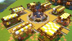 an aerial view of a village in minecraft with lots of yellow and white awnings