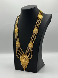 Indulge in the rich heritage of South Asia with our captivating necklace, a dazzling fusion of Indian, Pakistani, and Nepali influences. Inspired by the opulence of traditional jewelry, this exquisite piece showcases intricate craftsmanship and vibrant gemstones, reminiscent of royal adornments from the subcontinent. Embellish your neckline with its enchanting design, meticulously crafted to capture the essence of South Asian splendor. Elevate your style and embrace the cultural tapestry of Indi Bollywood Style Gold-plated Tilla Necklace, Festival Gold-plated Necklaces With Latkans, Traditional Gold-plated Coin Pendant Necklace, Gold Plated Latkans Necklaces For Festivals, Gold Plated Necklaces With Latkans For Festivals, Traditional Gold Plated Chain Necklace For Festive Occasions, Heavy Gold Bollywood Necklaces, Gold Temple Necklace With Intricate Design, Heavy Gold Bollywood Necklace