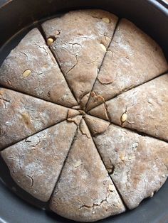 a pan filled with sliced up bread on top of a stove