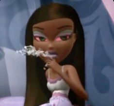 a doll with long black hair and pink eyes holding a toothbrush in her hand