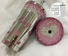 the tumbler cup has pink hearts on it and is next to an item that says perfect cups usa