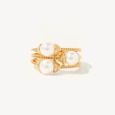 Indulge in the luxurious and elegant style of the Benedetta Pearl Ring. This exquisite piece features a multi band 14k gold roped metal design, with three lustrous pearls adding a touch of sophistication. Elevate any outfit and make a statement with this stunning ring. Please note: We strive to provide the most accurate representation of each piece. Due to the nature of these precious metals, you may notice details that are not depicted in the photographs. These are handmade, one-of-a-kind objec Preppy Jewelry, Designer Rings, Jewelry Accessories Ideas, Dope Jewelry, Jewelry Essentials, Stacked Jewelry, Jewelry Lookbook, Girly Jewelry, Elegant Accessories