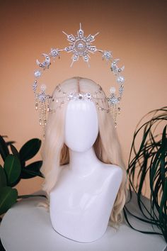 Hello :) this beautiful silver crown is made of moons and stars. In the atelier, we call this crown the Moon child crown. This headpiece is delicate, but at the same time extravagant, the crown is light and comfortable to wear. To make the headband, we used top-quality rhinestones, Czech glass beads and costume jewellery components. I can imagine this tiara for a wedding, maternity shoot, prom, Halloween, Burning man festival or any other special event. This crown was made for the goddess that y Sun Crown, Moon Crown, Crown Fairy, Halo Headpiece, Black Tiara, Crown Halo, Goddess Crown, Fairy Crown, Hair Accessories Bridal