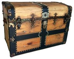 an old wooden trunk with rivets and leather straps