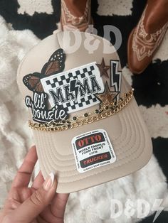 This custom made trucker patch hat is perfect for any occasion whether it be for spring/summer time, a lake hat, a gift for someone, or just a cute accessory to add a little spice to your outfit 🧢✨ DETAILS-  * This hat is one size with an adjustable SnapBack that is adjustable from 20in. - 23.5in. * The color of this hat is Tan * The material of the hat is polyester with iron on patches  REFUNDS AND CANCELLATIONS- Every hat is handmade by me as a result, a slight variation can occur from the picture with patch size or placement. If you have any problems with your hat please message me within 24 hours of receiving your order and I'd be happy to help! No refunds or exchanges will be accepted after. CONNECT- To enter giveaways, discount codes, or behind the scenes, follow our pages. 📲 Diamo Outfit With Trucker Hat, Trucker Hat Pins, Cowgirl Trucker Hat, Patch Hats Diy, Mama Trucker Hat, Trucker Hats For Women Outfits, Trucker Hat Bar Ideas, Custom Trucker Hats Patches, Hats With Patches