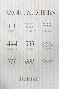 the numbers are written in gold on white paper with brown lettering and numbers below them