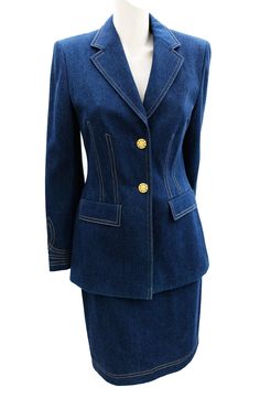 A classic 1990s vintage tailored skirt suit by Escada, in crisp mid blue denim with gold overstitching. It has a straight knee length skirt, front zip, unlined. And a hip length jacket with notched collar, flapped pockets,  and elaborate gold buttons.  The sleeves have an overstitched braiding design above the cuff. It is fully lined in navy logo imprint lining.   Material: 100% cotton Size: EU38 (German) UK10-12 Measurements (laid flat):   Jacket UK10-12 Shoulder to shoulder:  40cm Bust: 92cm L Vintage Denim Skirt, Vintage Lace Weddings, Tailored Skirt, Womens Suits, Lace Wedding Dress Vintage, Denim Pencil Skirt, Vintage Rock, Jeans Rock, Vintage Coat