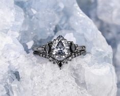 a diamond ring sitting on top of some ice