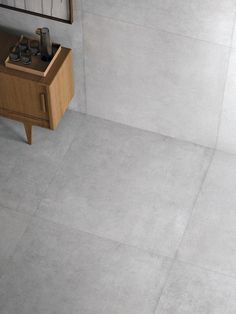 a bathroom with a sink, mirror and tiled floor