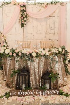 a decorated table with flowers and candles