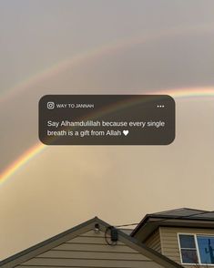 a rainbow appears in the sky over a house with a tweet on it