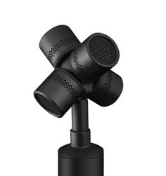 three black speakers sitting on top of each other in the shape of four heads,