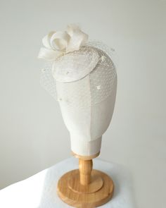 The millinery bridal hat is made of sinamay trimmed with bow trimming and birdcage veil. The veil on this pillbox is adorned with sweet little chenille dots. The hat attaches to the hair with flat hair comb from bottom side for easy placement to any hair style. Colours: light ivory (as pictured)  Also available in white, cream, lilac or beige sinamay for brides, black or navy for special occasion I make all my hats and trimmings using traditional millinery couture technique and patterns (not pre Tulle Hat For Weddings And Kentucky Derby, Elegant Tulle Mini Hats For Wedding, Adjustable Tulle Fascinator For Wedding, Adjustable Tulle Wedding Fascinator, Tulle Fascinator For Royal Ascot, Wedding Fascinator With Fitted Satin Bow, Wedding Fascinator With Satin Bow, Fitted Tulle Hats For Weddings, Wedding Costume Hats And Headpieces With Handmade Flowers