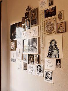 a wall covered in pictures and drawings on it