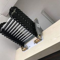 a rack that has many different types of knives on it and is attached to the wall