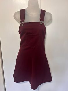 "Amazing vintage dress from the 70's!  Kandel Knitting Mills: Portland Oregon 100% Polyester - thick maroon.  Overall jumper with one pocket in front.  Adjustable straps  Zipper in back - does have some stretch Midi length In Excellent Vintage Condition with no visible flaws.  Measurements: Bust: 30\" - I was able to stretch into this at 34\" Waist: 28\" Length: 27\"" Fitted Sleeveless Vintage Suspender Dress, Casual Fitted Suspender Dress For Fall, Fitted Fall Pinafore Dress With Pockets, Fitted Casual Pinafore Dress For Fall, Retro Fitted Sleeveless Pinafore Dress, Fitted Sleeveless Pinafore Dress For Fall, Fitted Sleeveless Pinafore Dress With Pockets, Fitted Cotton Pinafore Dress For Fall, Fitted Mini Length Pinafore Dress For Fall