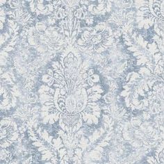 a blue and white wallpaper with an ornate design on it's surface,