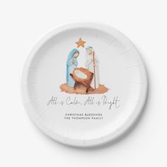 a paper plate with an image of the birth of jesus and baby jesus on it