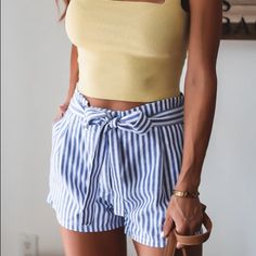 Sweet Linen Stripe Shorts For Your Spring Outfits! Tie Is Connected From The Back And You Tie Along The Front. These Casual Yet Chic Shorts Would Be Perfect For Warmer, Summer Days. Complete The Look With A White Bodysuit, Flat Mules, And A Light Cardigan. Model Is Wearing A Size Small A 2/4 M 6 L 8/10 Xl 12 Blue Tie Waist Bottoms For Spring, Blue Bottoms With Tie Waist For Spring, Striped Tie Waist Bottoms For Summer, Blue Tie Waist Shorts For Spring, Blue Bottoms With Tie Waist For Day Out, Blue Tie-waist Bottoms For Day Out, Blue Shorts With Tie Waist For Spring, Casual Blue Bottoms With Tie Waist, Blue Vacation Pants With Short Length