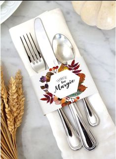 thanksgiving printable place cards on napkins with forks and spoons next to wheat stalks