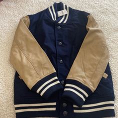 2 Tone Navy And Beige Youth Bomber/Varsity Style Jacket. Size Small (6/7) Sporty School Outerwear With Pockets, Winter Brown Outerwear For School, Sporty Gap Outerwear For Winter, Gap Outerwear For Fall Streetwear, Sporty Navy Outerwear For School, Blue Fall Outerwear For School, Gap Beige Outerwear For Fall, Beige Gap Outerwear For Fall, School Varsity Outerwear With Pockets