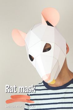 a person wearing a paper mask with the words rat mask on it's face