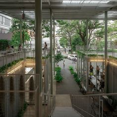 an open air courtyard with plants growing on the walls