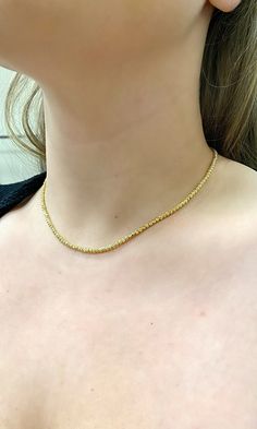 14k Diamond Cut beaded layering chain. Perfectly worn Alone or with a pendant. Also gorgeous as a choker/ stackable necklace. Material: Genuine 14k solid gold. Length: 16 inch. (Available in other lengths, weight will vary slightly on length chosen.) Width: Approximately 2.5mm wide. Weight: Approximately 8.6 grams. Comes in a nice box. Gold Plated Round Beads Chain Necklace, Gold Plated Chain Necklace With Round Beads, Dainty Single Strand Round Chain Necklace, Gold Single Strand Choker Chain Necklace, Gold Single Strand Chain Choker Necklace, Dainty Necklace With Round Beads Chain, Everyday Necklaces With Round Beads And Chain, Dainty Yellow Gold Beaded Chain Necklace, Gold Dainty Beaded Necklace With Chain