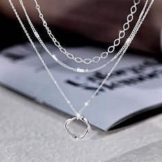 【Length】① Paperclip Necklace: 14"+2" adjustable extender. ② Simple Silver Chain: 16.5"+2" adjustable extender. ③ Twisted Circle Pendant Necklace: 18.5"+2" adjustable extender. Ensure you can wear fit and comfort 【Material】High-Quality 925 Sterling Silver Plated. Lead-free, nickel-free, and hypoallergenic. It's very Skin-Friendly and suitable for daily wear 【Feature】Simple design layered necklaces, you can wear each other as a single necklace or layering them all even match other necklaces which Charm Necklaces With Adjustable Chain In Alloy, Adjustable Round Layered Necklace With Clavicle Chain, Adjustable Round Clavicle Chain Layered Necklace, Adjustable Clavicle Chain Layered Necklace, Adjustable Alloy Charm Necklaces, Adjustable Silver Layered Necklace With Clavicle Chain, Adjustable Silver Layered Clavicle Necklace, Silver Adjustable Charm Necklace With Double Chain, Adjustable Silver Charm Necklace With Double Chain