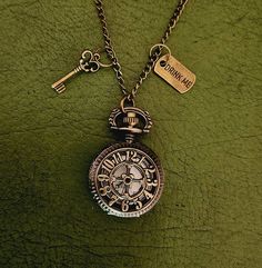 "Alice in Wonderland Pocketwatch Necklace with Antique Style Key and \"Drink Me\" Label Bronze coloured Brand new with working battery Chain length is 80cm but I can adjust it to a smaller size upon request. Clock is 2.5cm x 2.5cm (Also available in a larger size)" Alice In Wonderland Necklace, Alice In Wonderland Watch, Alice In Wonderland Vintage, Antique Keys, Drink Me, Watch Necklace, Bronze Color, Antique Style, Resin Jewelry