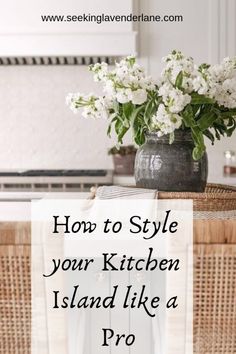 a basket with flowers on it and the words how to style your kitchen island like a pro