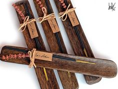 four wooden sticks with tags tied to them