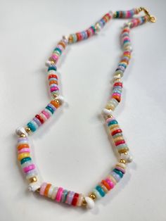 Handmade 14" beaded necklace complete with tiny seashells! Gold plated findings and clasp. Summer Shell Beaded Colorful Necklaces, Summer Shell Beaded Necklaces With Colorful Beads, Multicolor Beaded Strand Shell Necklace, Multicolor Shell Strand Necklace, Multicolor Beaded Shell Necklace Strand, Colorful Beaded Shell Necklace For Summer, Summer Shell Necklace With Colorful Round Beads, Summer Colorful Beaded Shell Necklaces, Handmade Multicolor Strand Shell Necklace