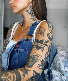 a woman with tattoos on her arm and shoulder