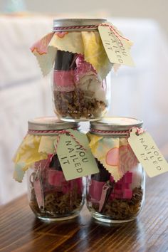 three jars filled with different types of items